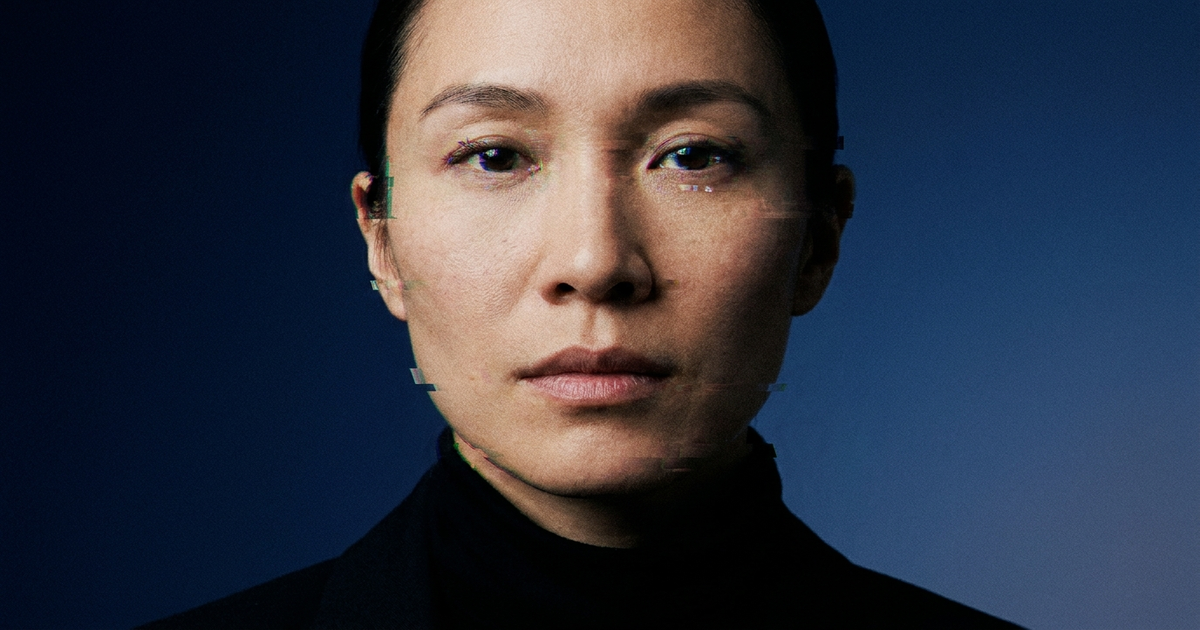 A video frame with a subtle glitch artifact around the face, dark blue gradient background, no robot imagery A video frame with a subtle glitch artifact around the face, dark blue gradient background, no robot imagery