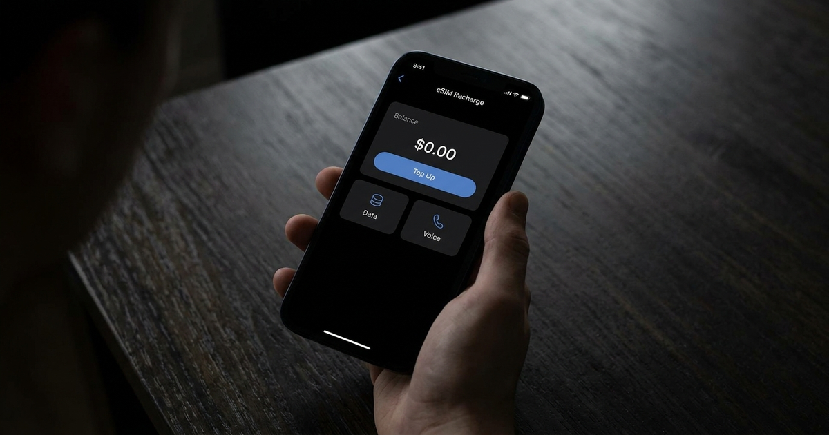 Phone showing an eSIM top-up/recharge screen with a balance and 'Top Up' button, dark background