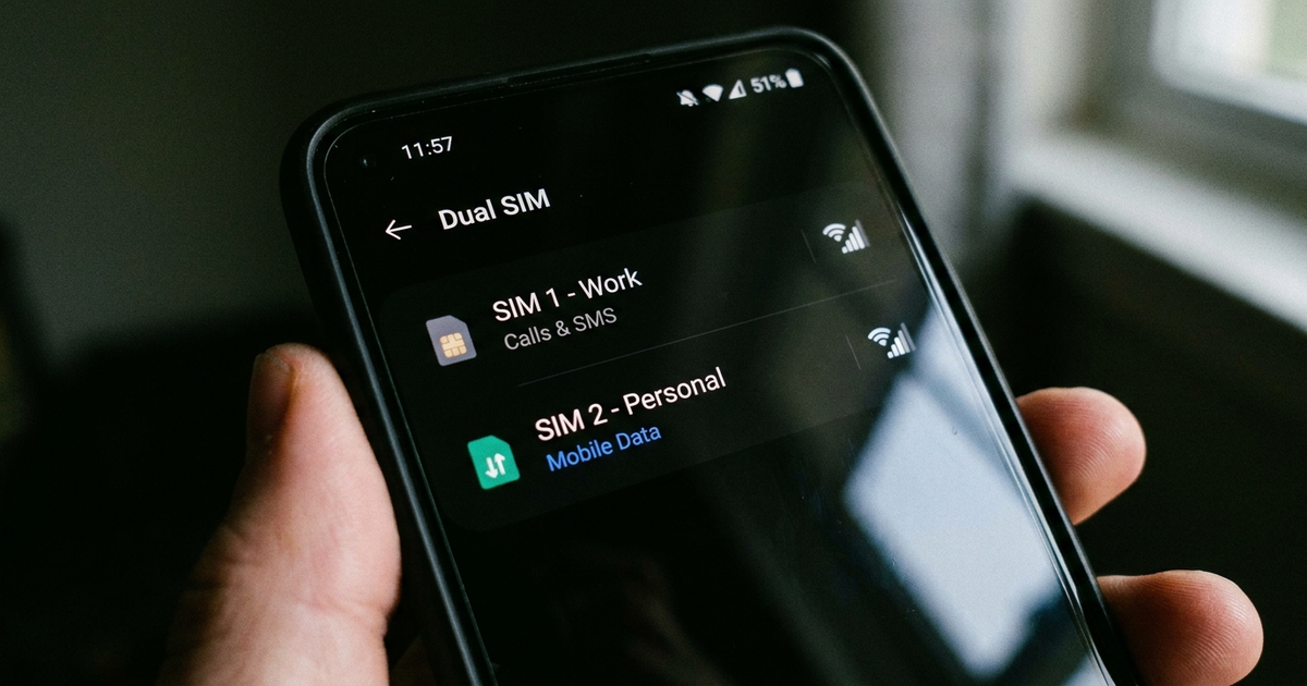 Phone settings screen showing two active SIM lines, one set to calls and texts and one set to data, dark background Phone settings screen showing two active SIM lines, one set to calls and texts and one set to data, dark background